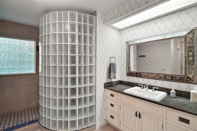 bathroom featuring vanity and walk in shower