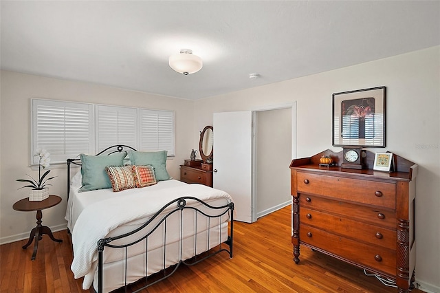 bedroom with wood-type flooring