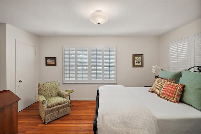 bedroom with wood-type flooring