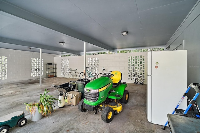 garage with white refrigerator