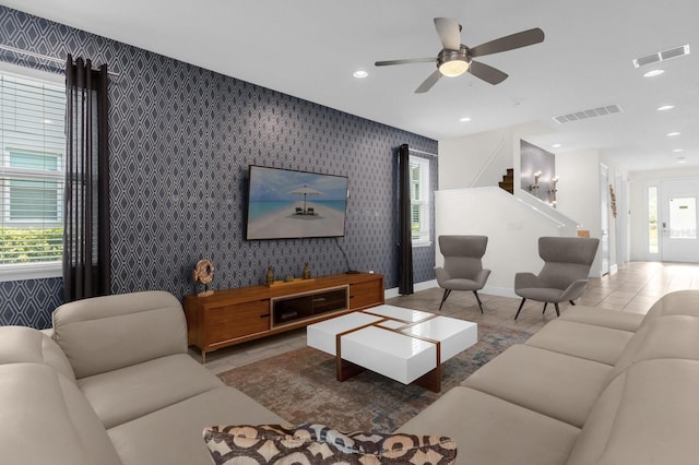 living room with plenty of natural light and ceiling fan