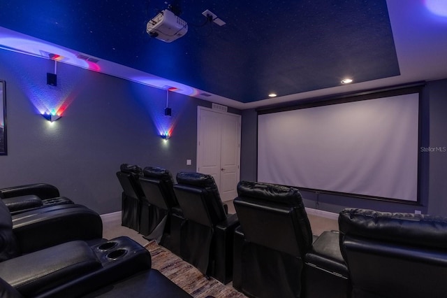 home theater room featuring a tray ceiling