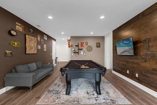 game room featuring wooden walls, wood-type flooring, and pool table