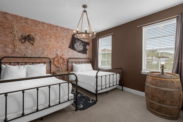 carpeted bedroom featuring a notable chandelier