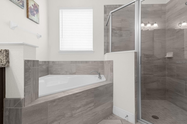 bathroom with separate shower and tub