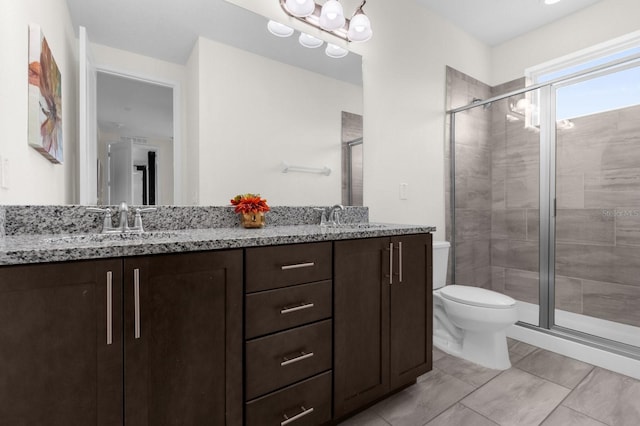 bathroom featuring walk in shower, vanity, and toilet