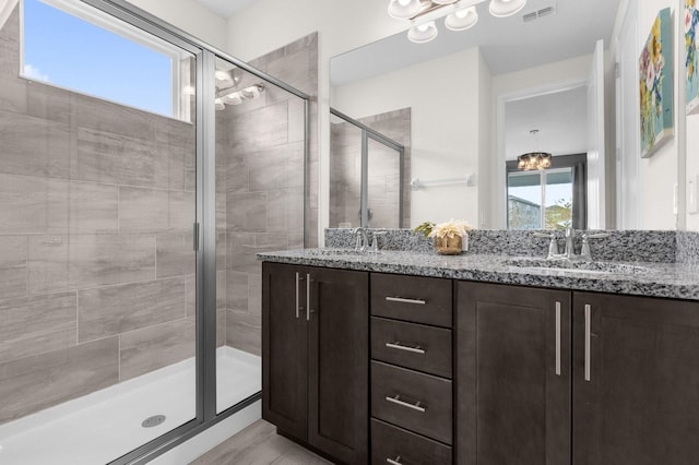 bathroom with vanity and an enclosed shower