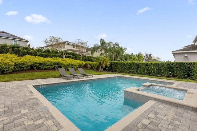 view of pool featuring an in ground hot tub and a patio