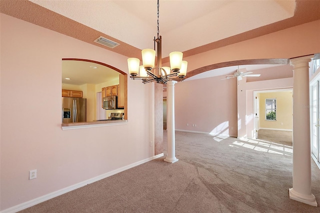 interior space featuring ornate columns and ceiling fan with notable chandelier