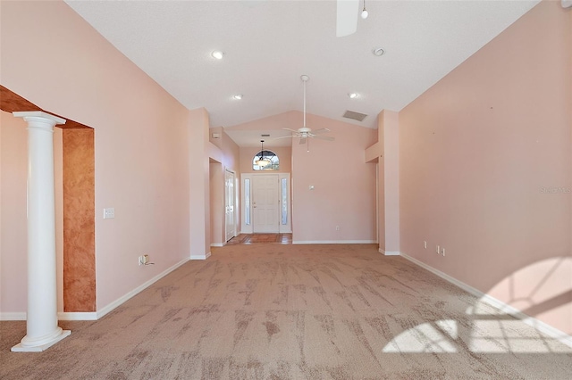 interior space featuring ceiling fan, ornate columns, and lofted ceiling