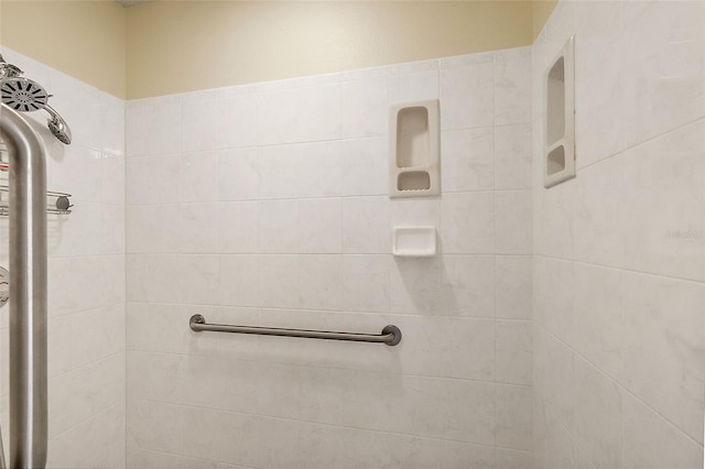 bathroom with tiled shower