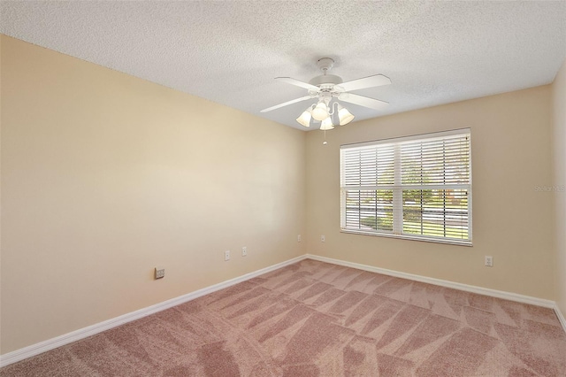 unfurnished room featuring carpet flooring, ceiling fan, and a textured ceiling