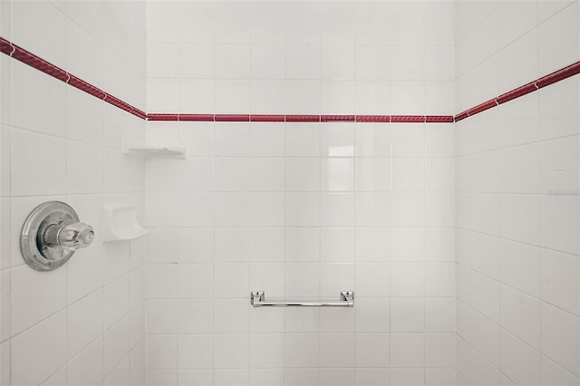 bathroom with tiled shower