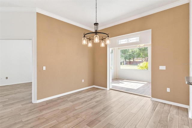 unfurnished dining area featuring crown molding, light hardwood / wood-style flooring, and a notable chandelier