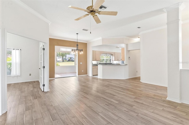 unfurnished living room featuring crown molding, ceiling fan with notable chandelier, and light wood-type flooring