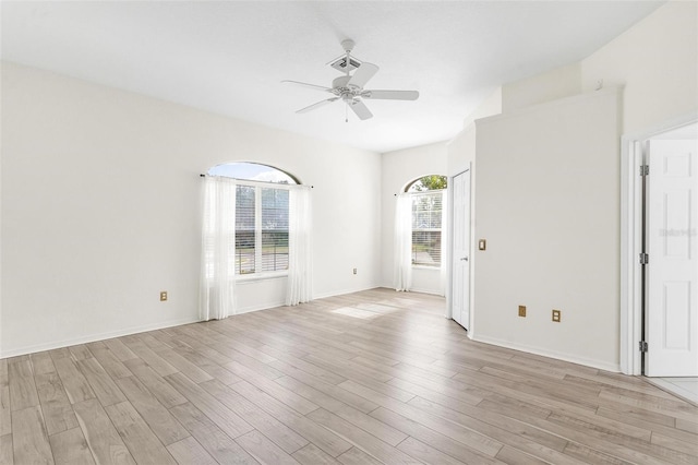 spare room with ceiling fan and light hardwood / wood-style flooring