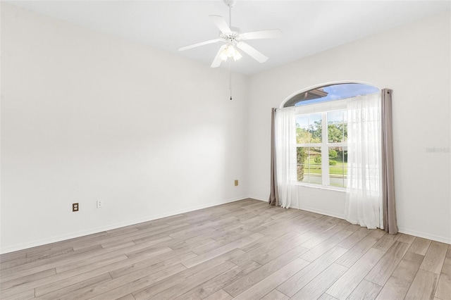 unfurnished room with ceiling fan and light wood-type flooring