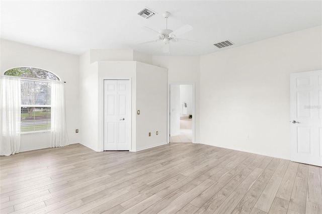 unfurnished room featuring ceiling fan and light wood-type flooring