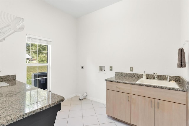 laundry area with light tile patterned flooring, electric dryer hookup, sink, and washer hookup