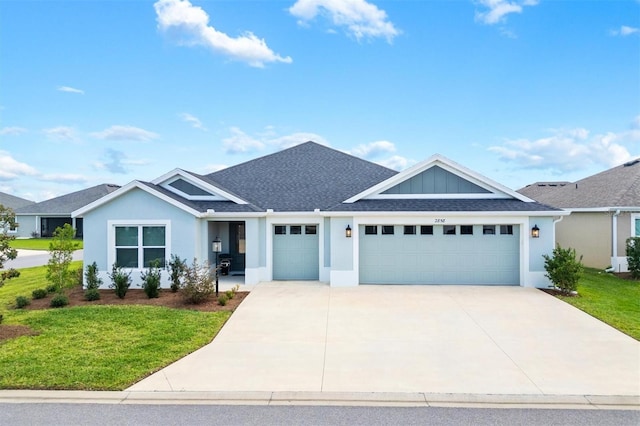 view of front of house with a garage and a front lawn