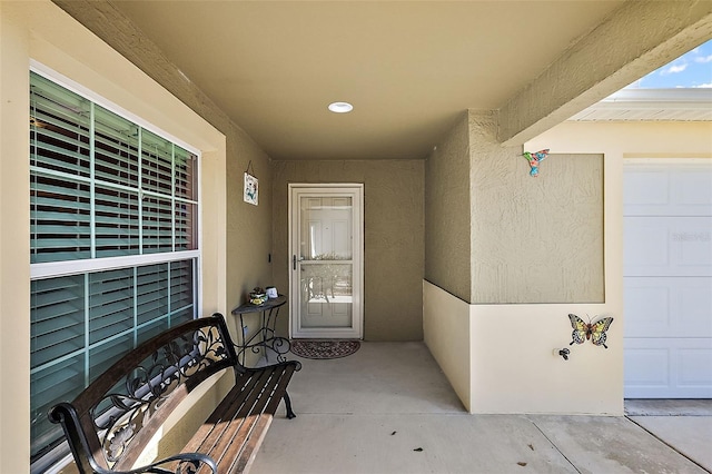 doorway to property featuring a garage