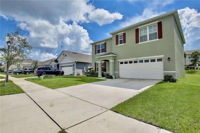 view of front of house with a front yard and a garage