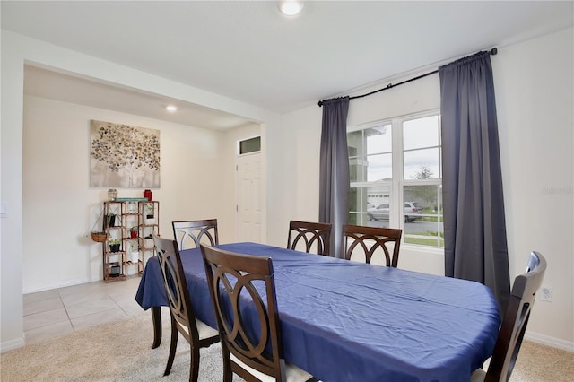 dining area with light tile patterned flooring