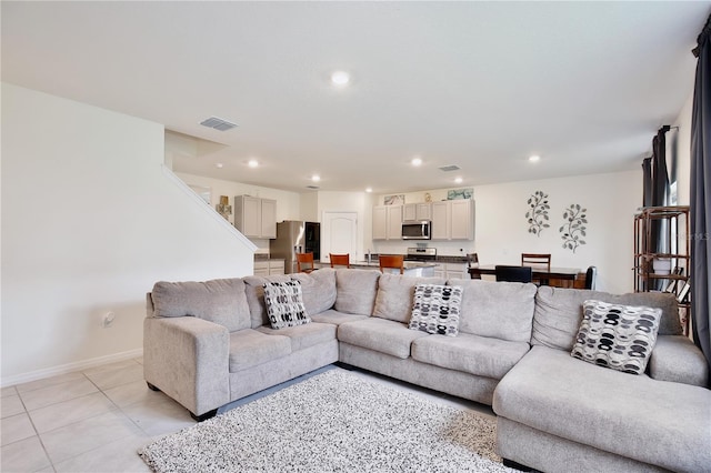 living room with light tile patterned floors