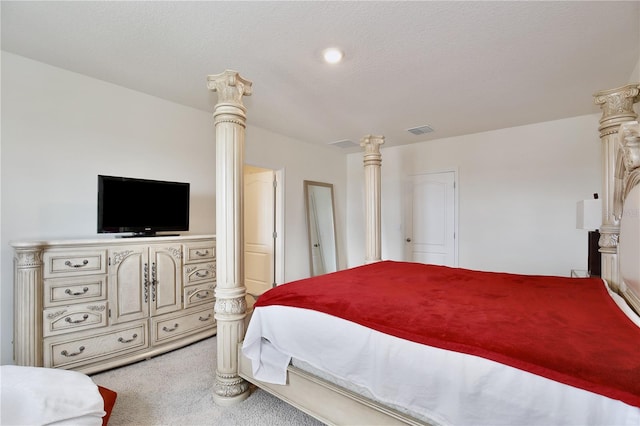 bedroom featuring light colored carpet