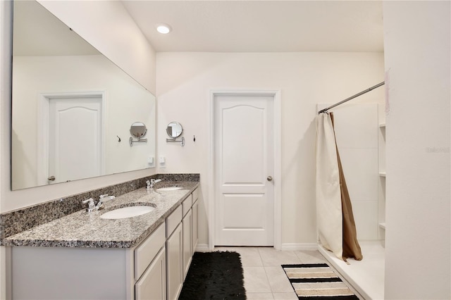 bathroom with tile patterned flooring, a shower with curtain, and vanity