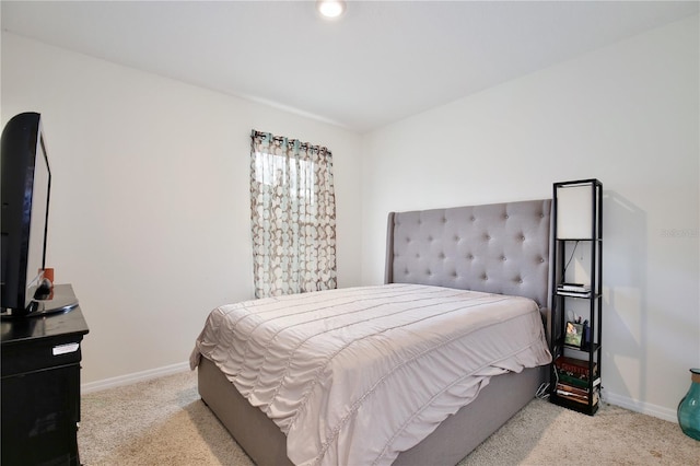 bedroom with light colored carpet