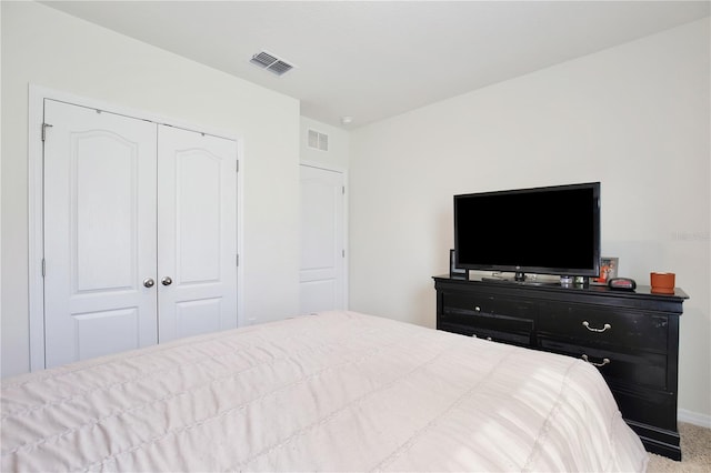 carpeted bedroom with a closet