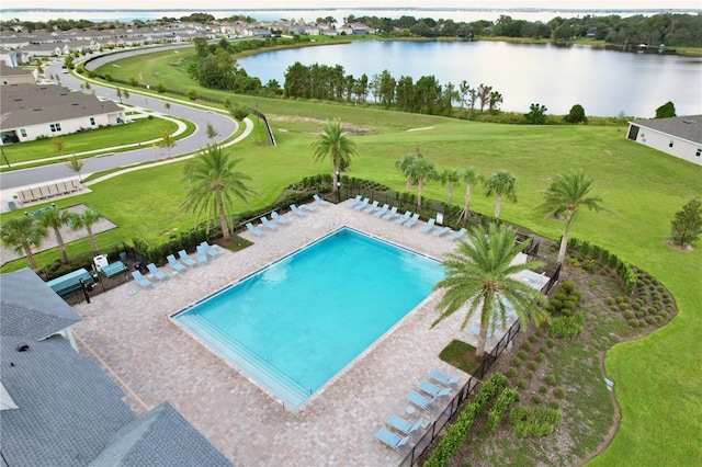 view of swimming pool featuring a water view