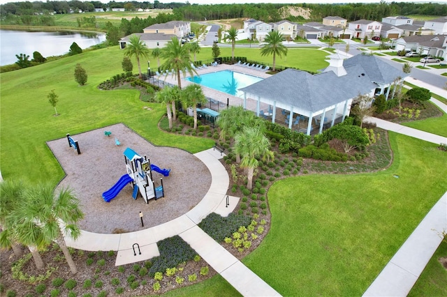 birds eye view of property with a water view