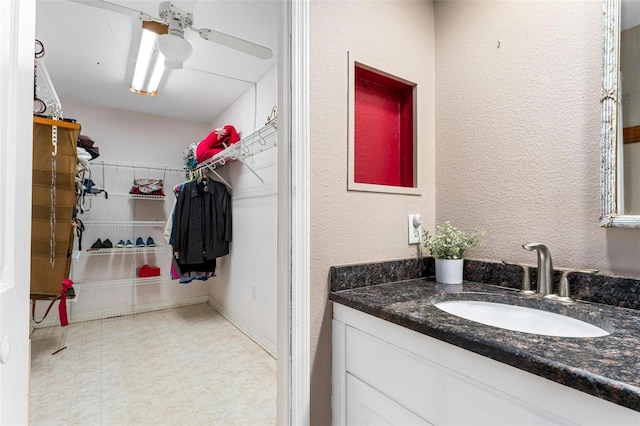 bathroom featuring vanity and ceiling fan