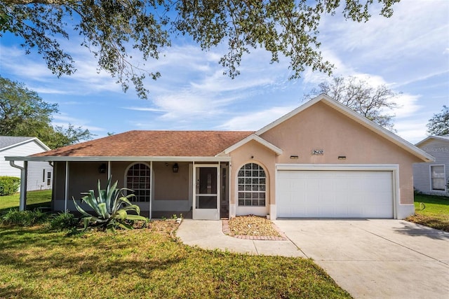 ranch-style home with a front yard and a garage