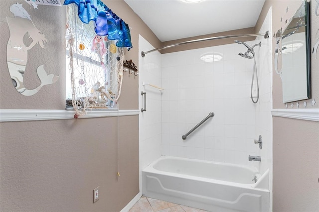 bathroom with tile patterned flooring and tiled shower / bath