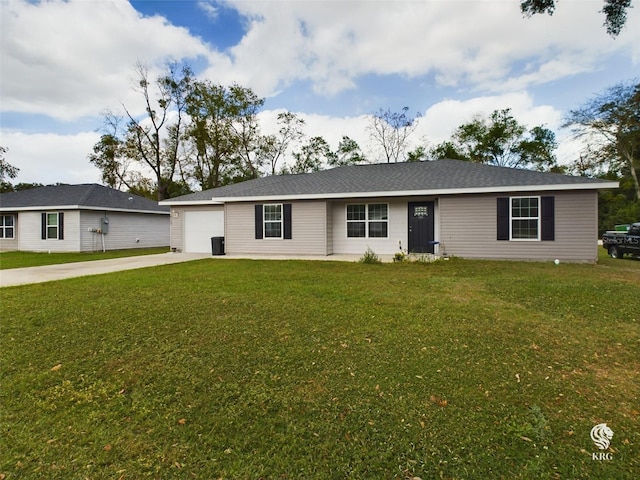 ranch-style house featuring a garage and a front yard