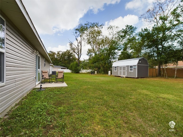 view of yard with a patio area and a storage unit