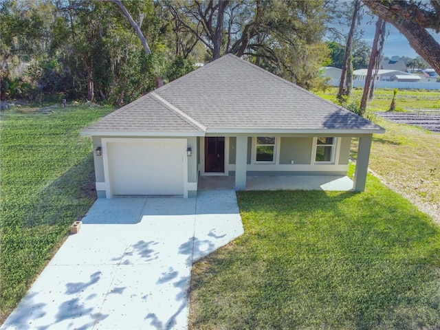 ranch-style home with a shingled roof, stucco siding, concrete driveway, a front lawn, and a garage