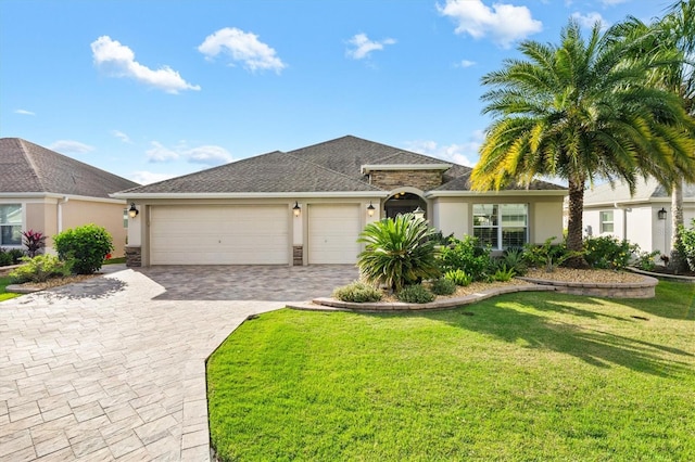 view of front of home with a garage and a front yard