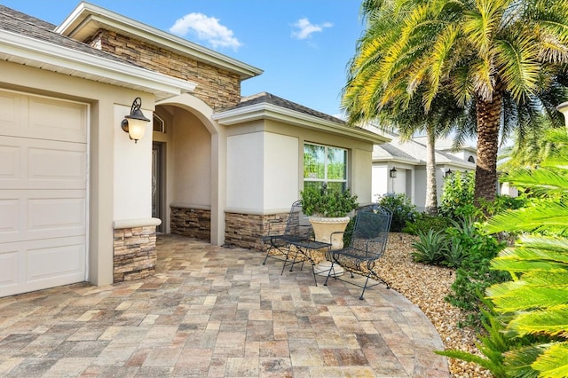 view of patio / terrace featuring a garage