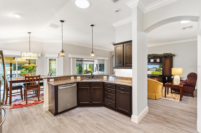 kitchen with sink, light hardwood / wood-style floors, stainless steel dishwasher, and light stone counters