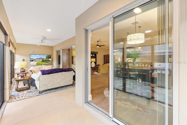 interior space with ceiling fan