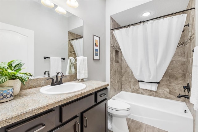 bathroom featuring hardwood / wood-style flooring, vanity, and toilet