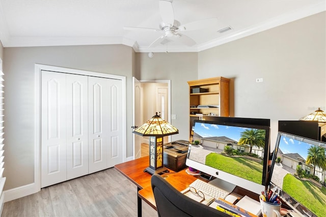 interior space featuring lofted ceiling, light hardwood / wood-style floors, ceiling fan, and crown molding