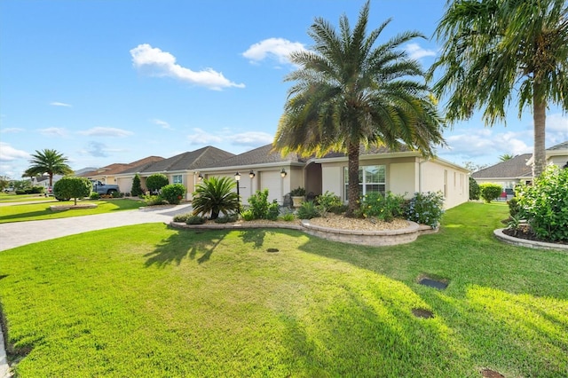 view of front of house with a garage and a front lawn