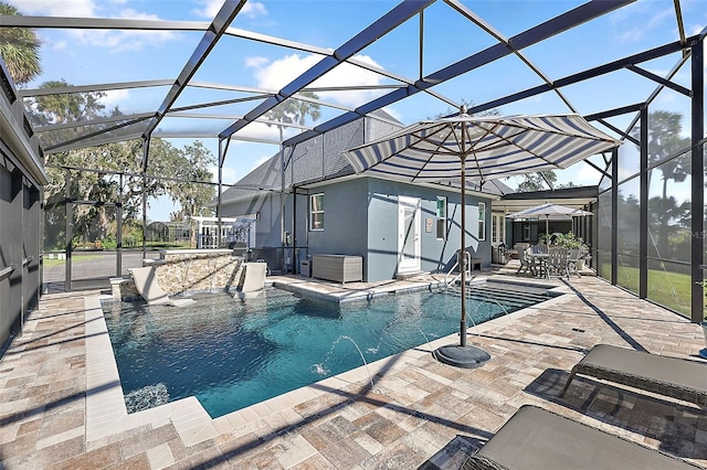 view of swimming pool with pool water feature, a lanai, and a patio area