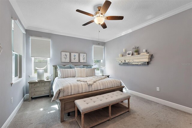 bedroom with multiple windows, light carpet, ceiling fan, and ornamental molding