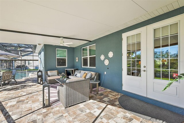 view of patio / terrace with outdoor lounge area, french doors, glass enclosure, and ceiling fan